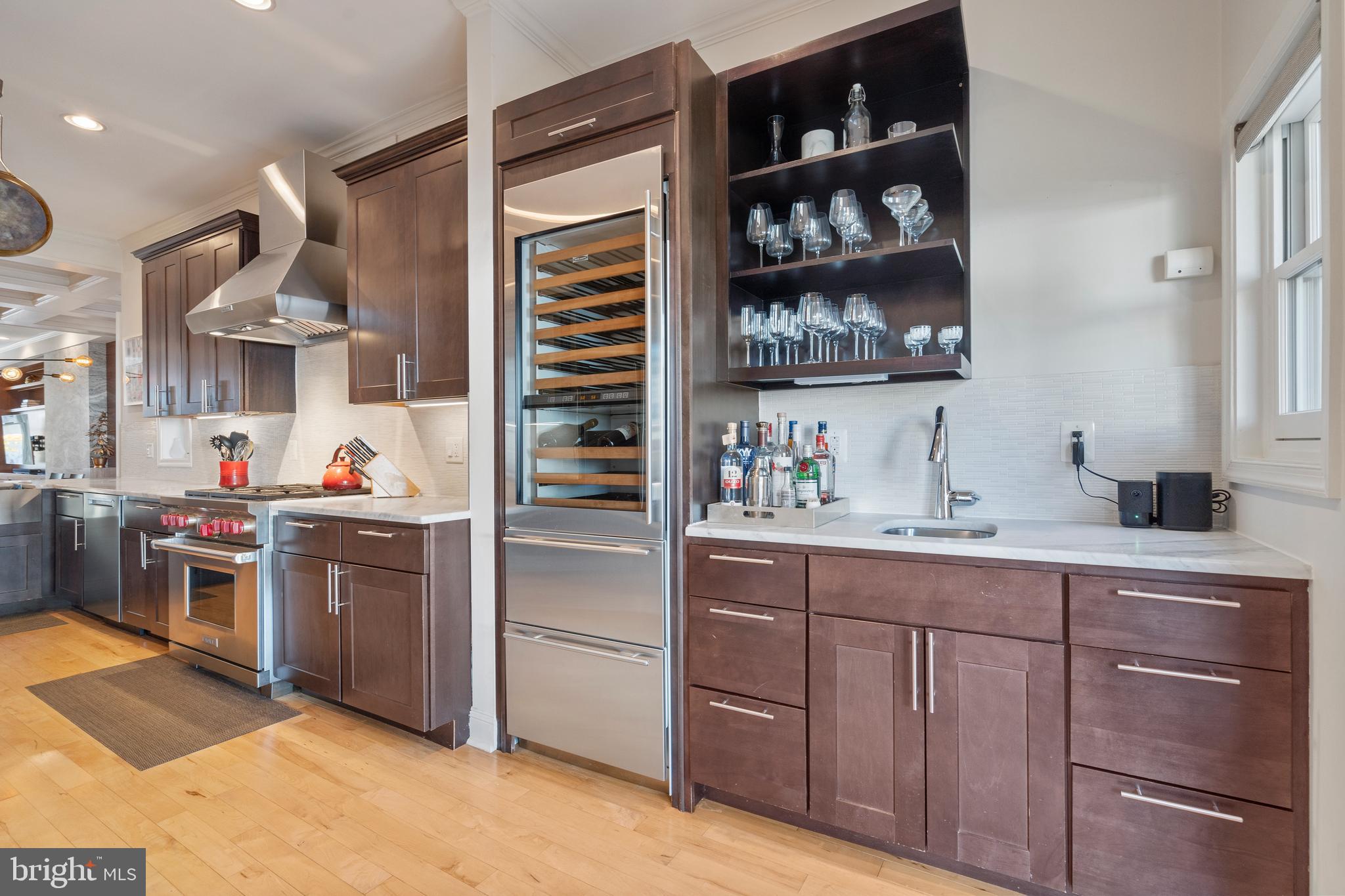 33 W Street Northwest, Unit 1 Washington, DC 20001 - Photo 17 of 36 a kitchen with stainless steel appliances granite countertop a refrigerator and a stove top oven
