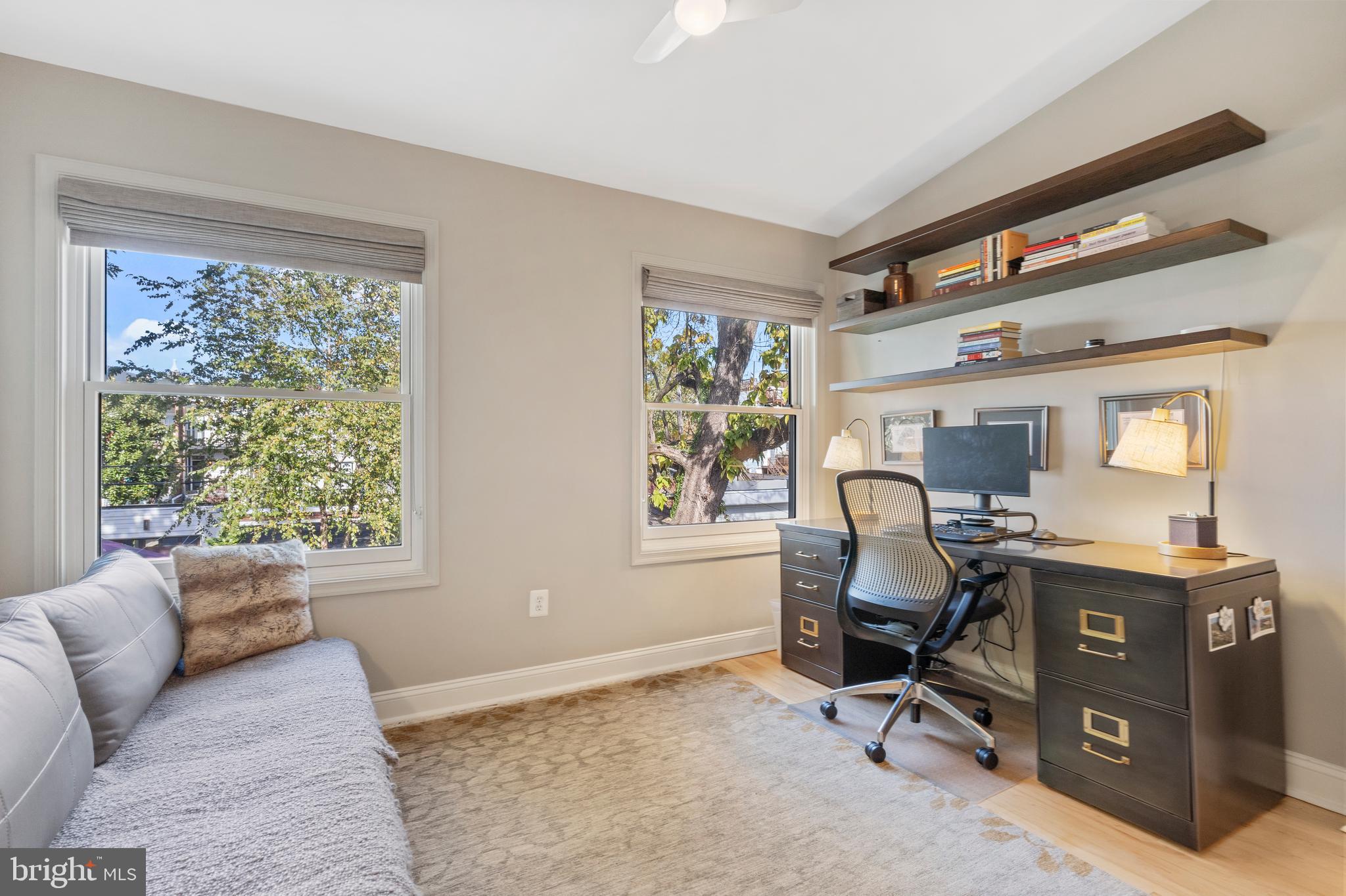 33 W Street Northwest, Unit 1 Washington, DC 20001 - Photo 22 of 36 a view of a livingroom with workspace and a window