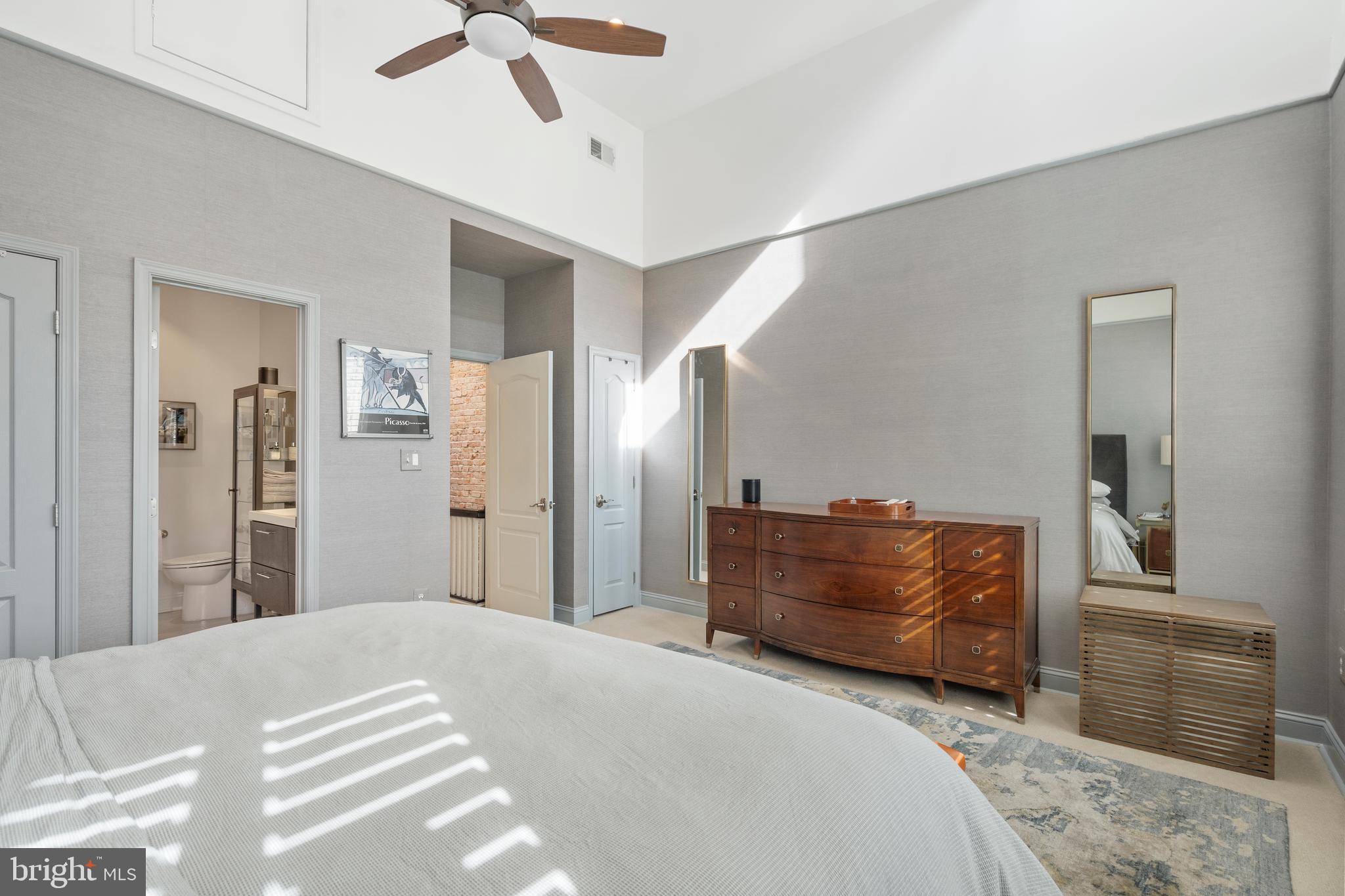 33 W Street Northwest, Unit 1 Washington, DC 20001 - Photo 30 of 36 a bedroom with a bed and a chandelier fan