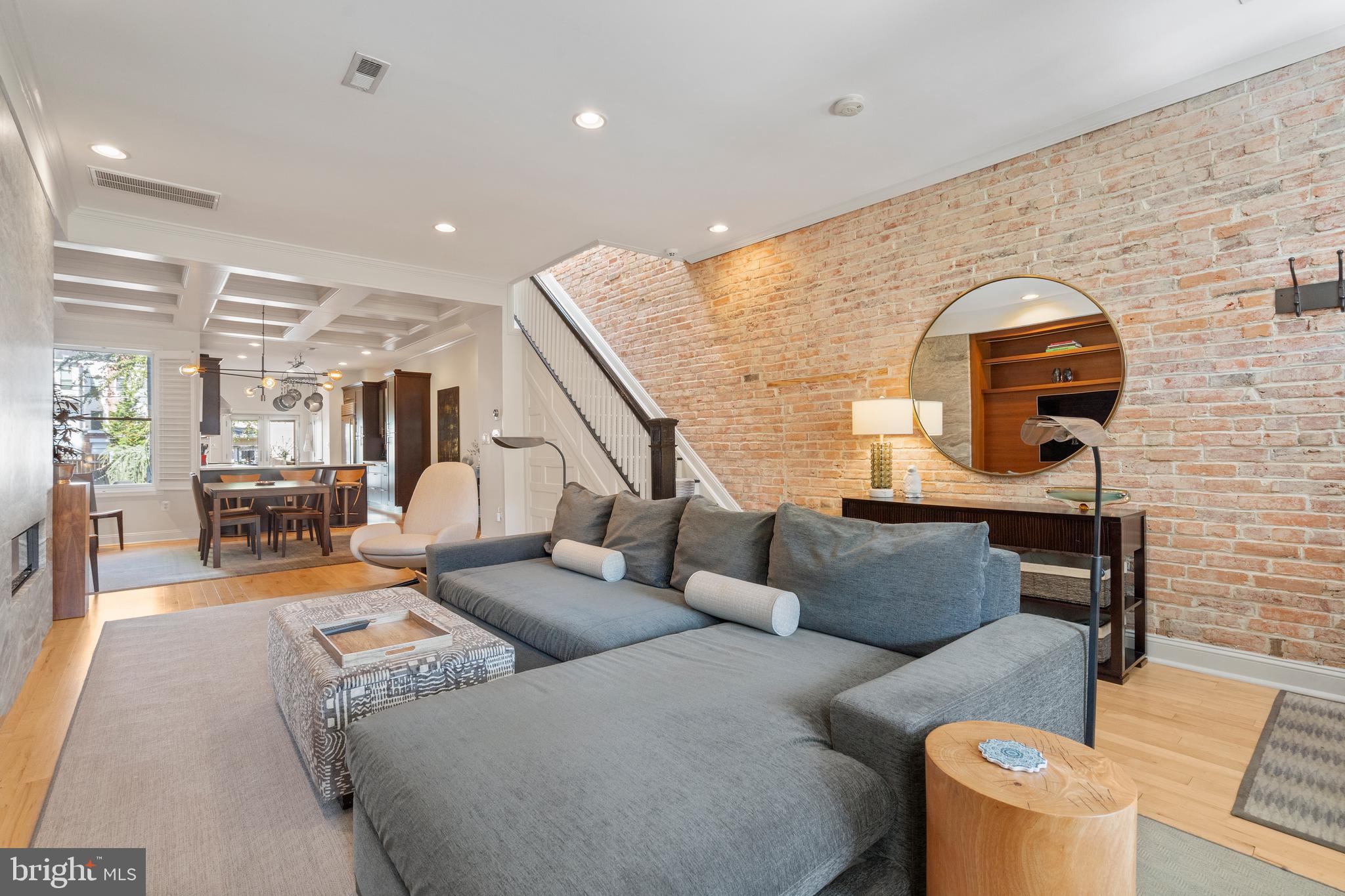 33 W Street Northwest, Unit 1 Washington, DC 20001 - Photo 3 of 36 a living room with furniture and wooden floor