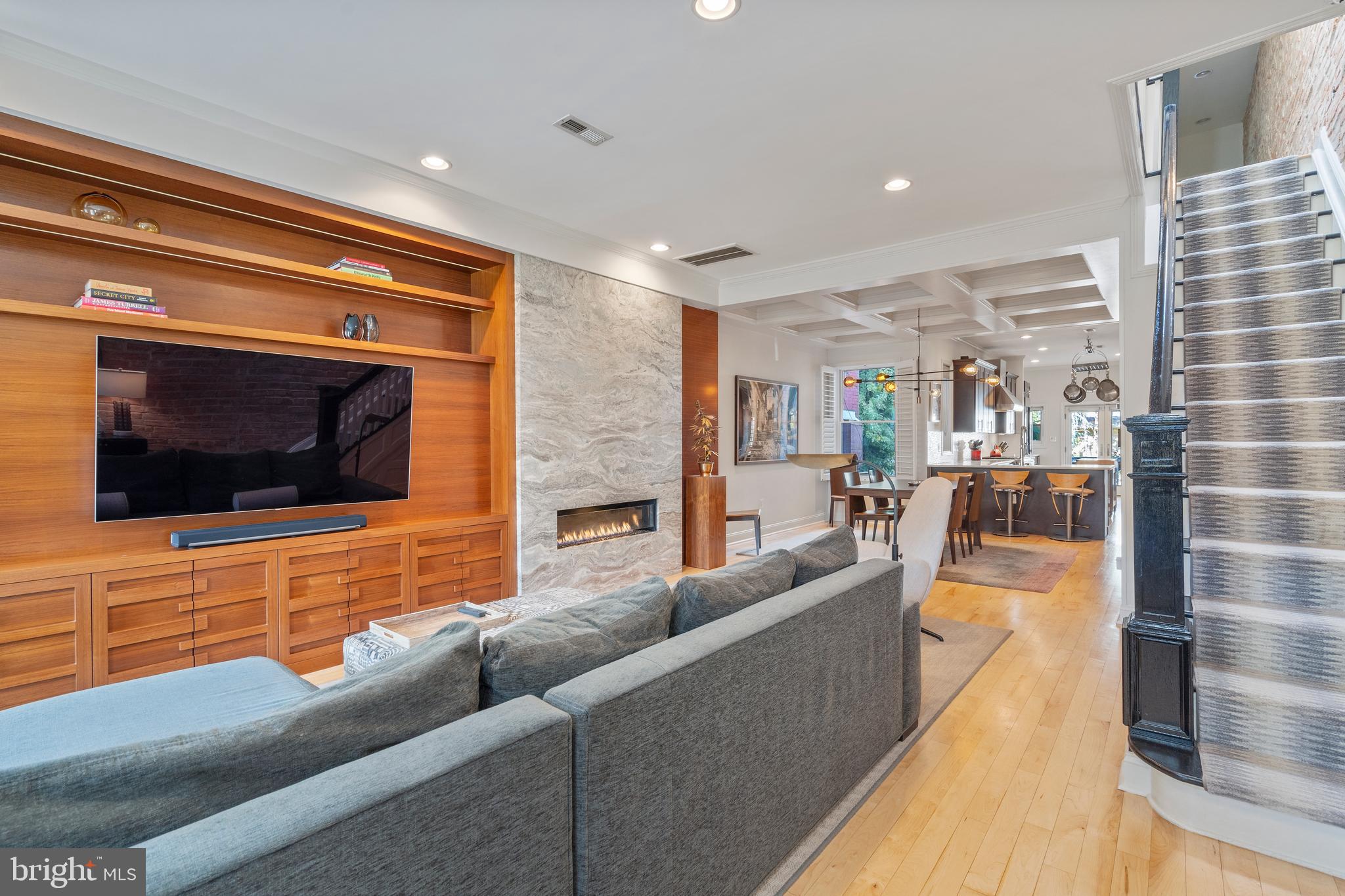 33 W Street Northwest, Unit 1 Washington, DC 20001 - Photo 4 of 36 a living room with furniture and a flat screen tv