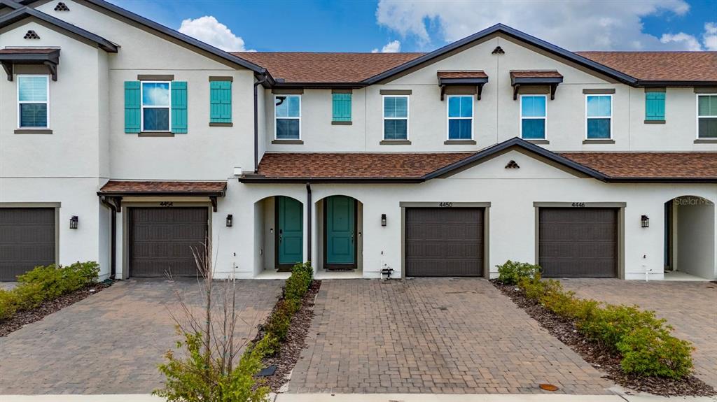 4450 Small Creek Road Kissimmee, FL 34744 - Photo 1 of 25 a view of a house with a yard