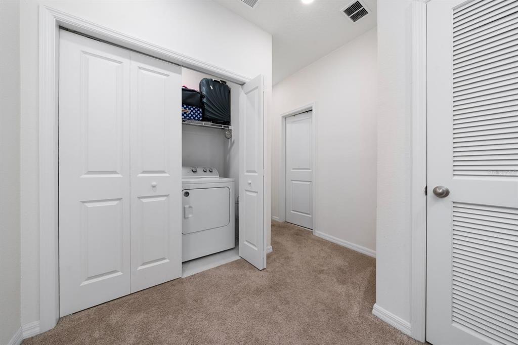 4450 Small Creek Road Kissimmee, FL 34744 - Photo 18 of 25 a view of a bathroom with a sink and mirror