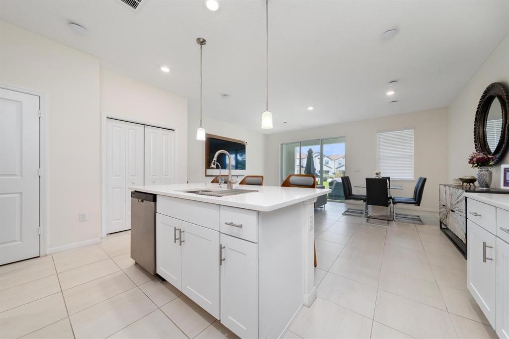 4450 Small Creek Road Kissimmee, FL 34744 - Photo 5 of 25 a living room with furniture and a flat screen tv