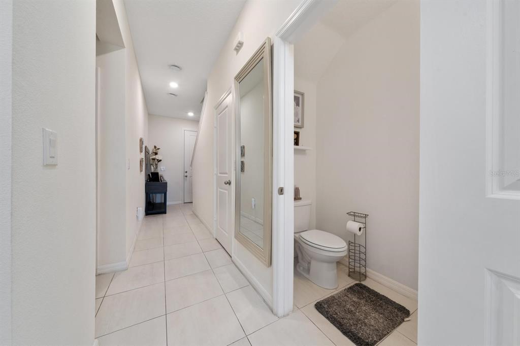 4450 Small Creek Road Kissimmee, FL 34744 - Photo 9 of 25 a bathroom with a sink and a toilet