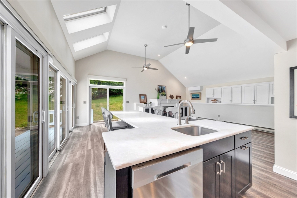 118 Woolford Road Wrentham, MA 02093 - Photo 17 of 41 a kitchen with a sink a stove and chairs