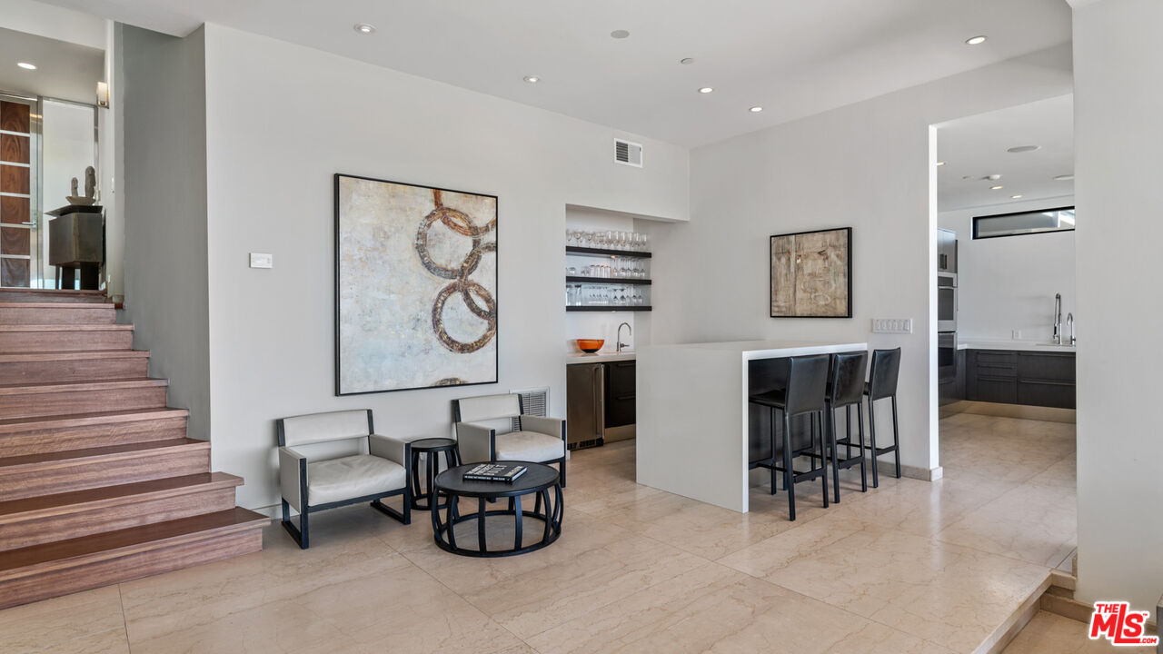 25250 Malibu Road Malibu, CA 90265 - Photo 22 of 69 a living room with furniture and a fireplace