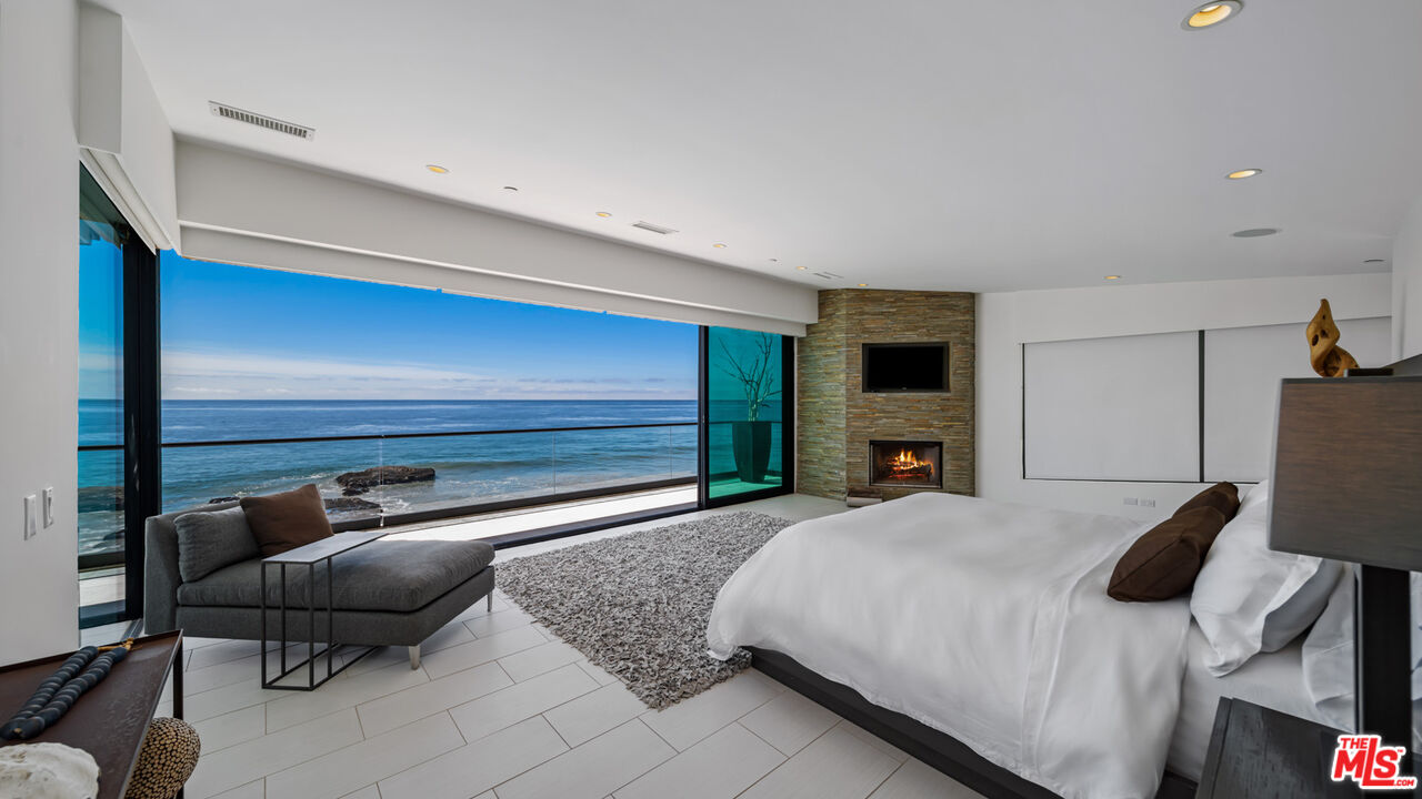 25250 Malibu Road Malibu, CA 90265 - Photo 31 of 69 a bedroom with a bed and a couch