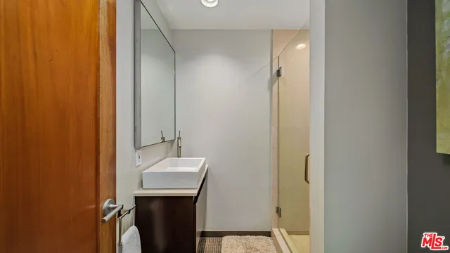 a bedroom with a bed and a fireplace