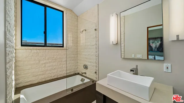 a view of a swimming pool with an outdoor space and seating area