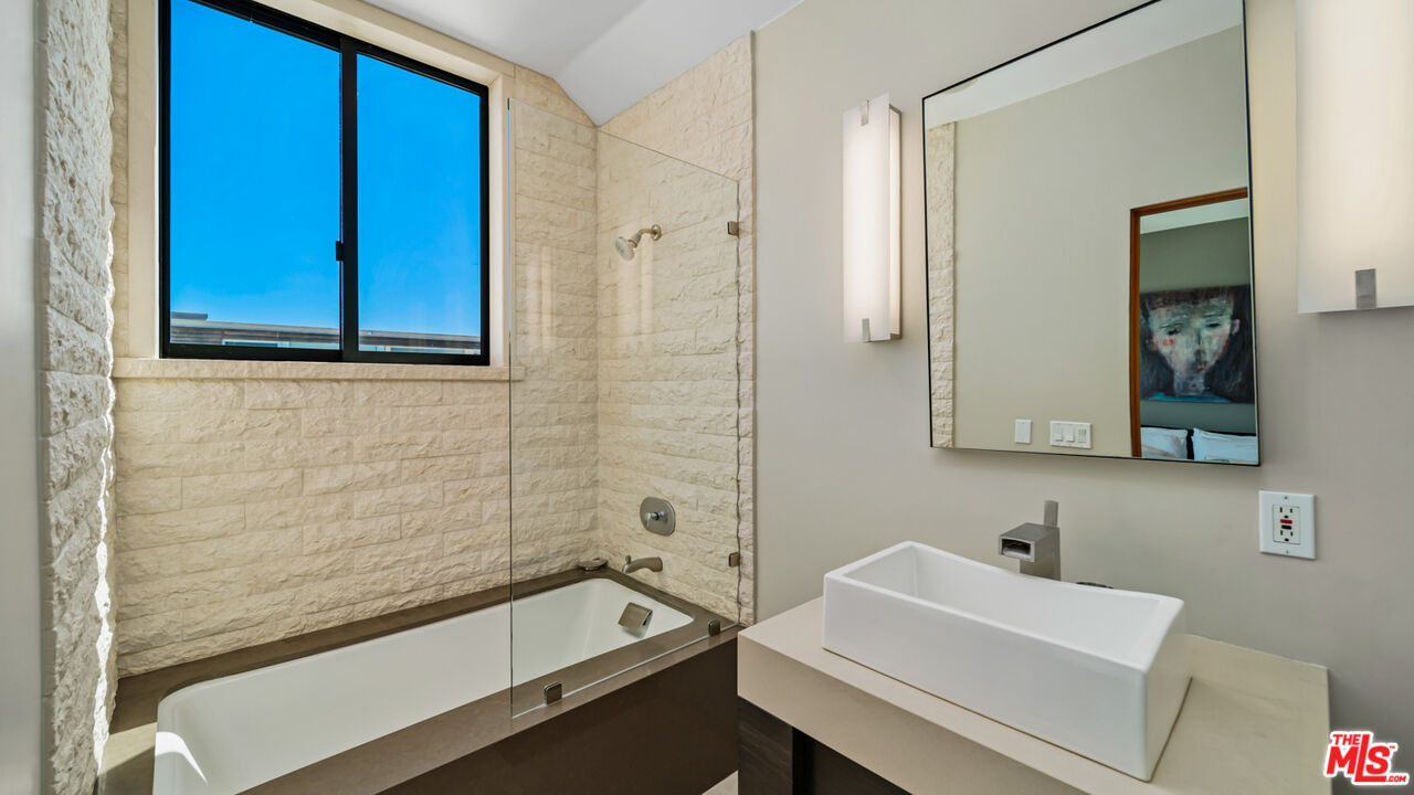 25250 Malibu Road Malibu, CA 90265 - Photo 49 of 69 a bathroom with a sink and a bathtub