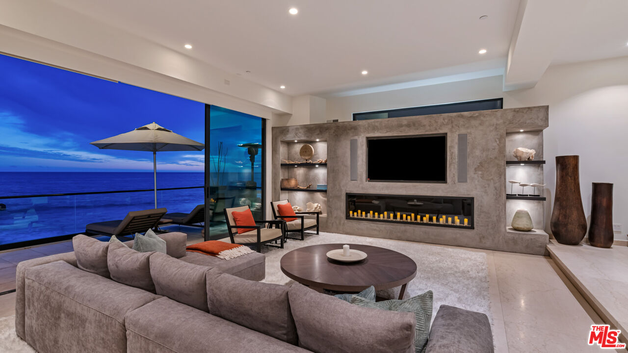 25250 Malibu Road Malibu, CA 90265 - Photo 57 of 69 a living room with furniture and a flat screen tv