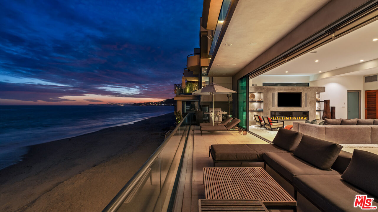 25250 Malibu Road Malibu, CA 90265 - Photo 60 of 69 a living room with furniture and a flat screen tv