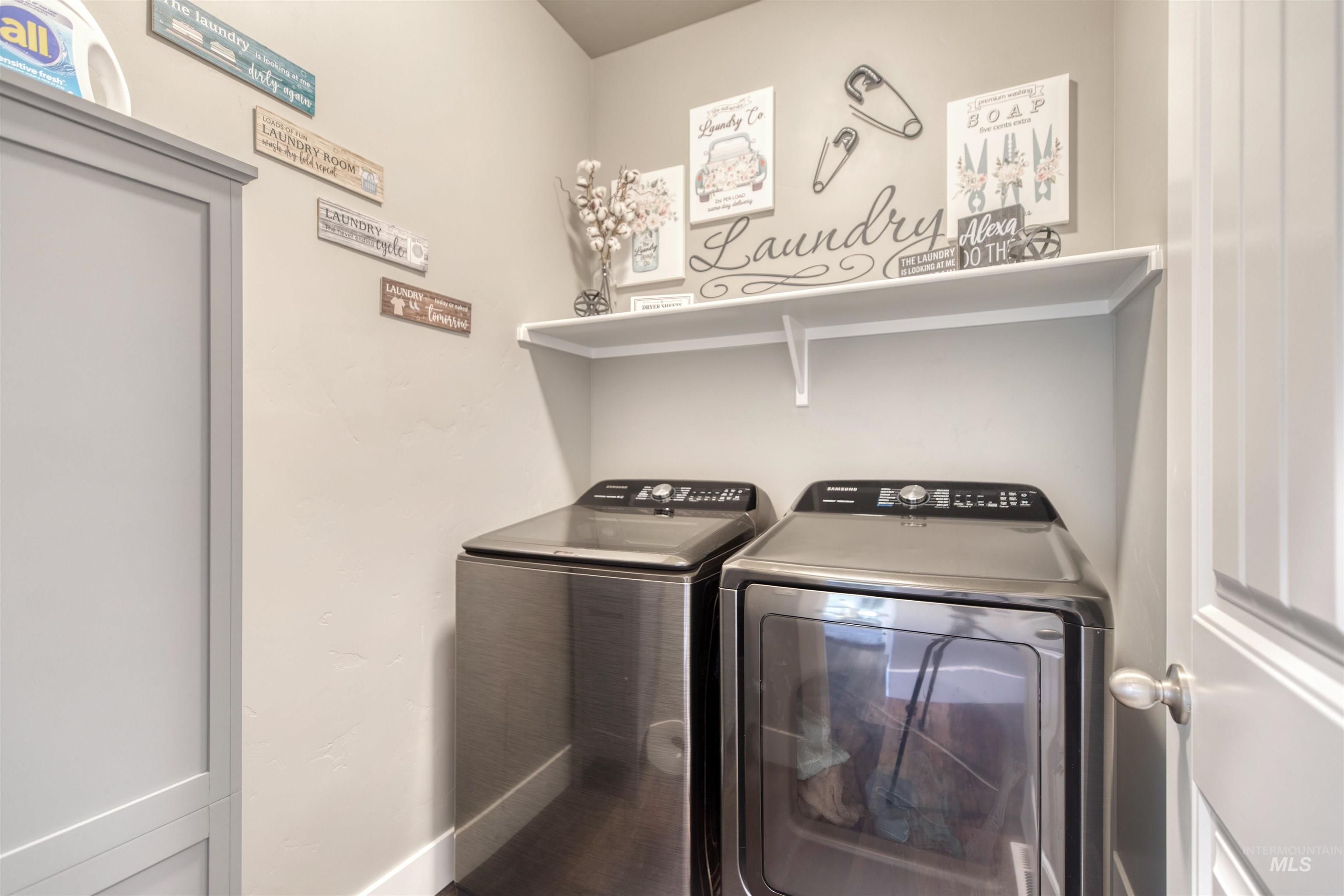 11913 West Piazza Street Nampa, ID 83686 - Photo 17 of 50 Laundry room featuring independent washer and dryer and baseboards