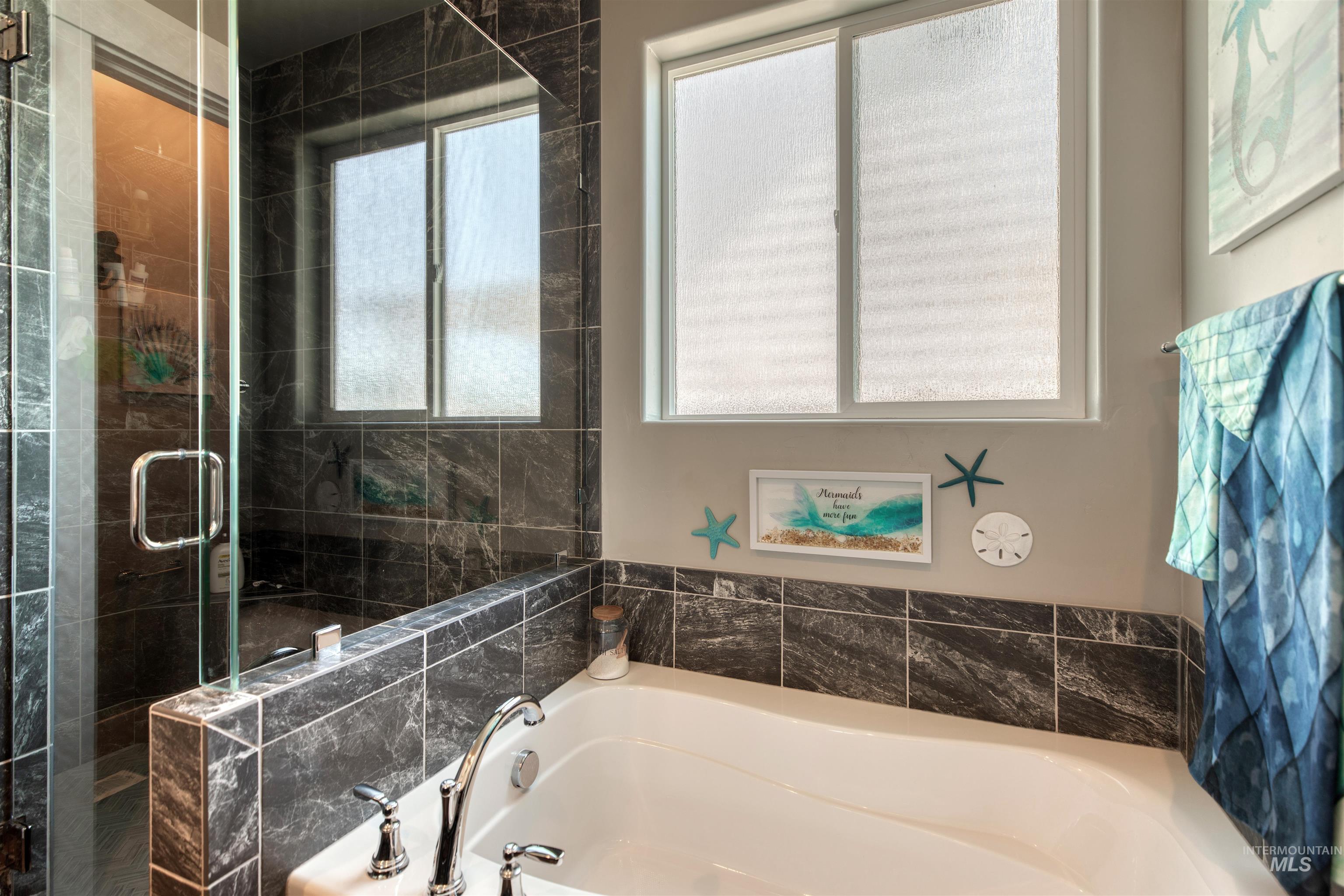 11913 West Piazza Street Nampa, ID 83686 - Photo 22 of 50 Full bath with a stall shower and a garden tub