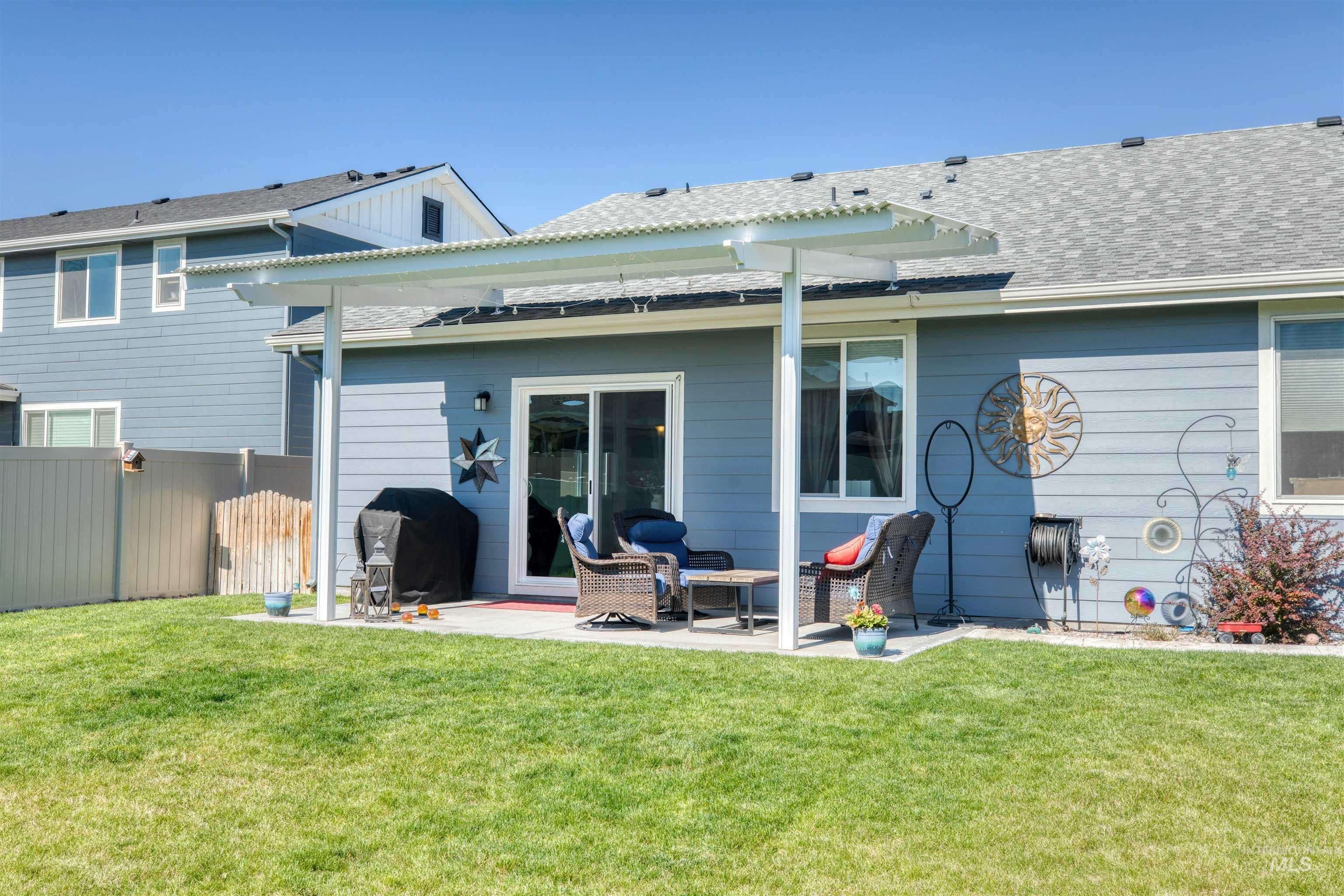 11913 West Piazza Street Nampa, ID 83686 - Photo 29 of 50 Rear view of property with a patio area and a shingled roof