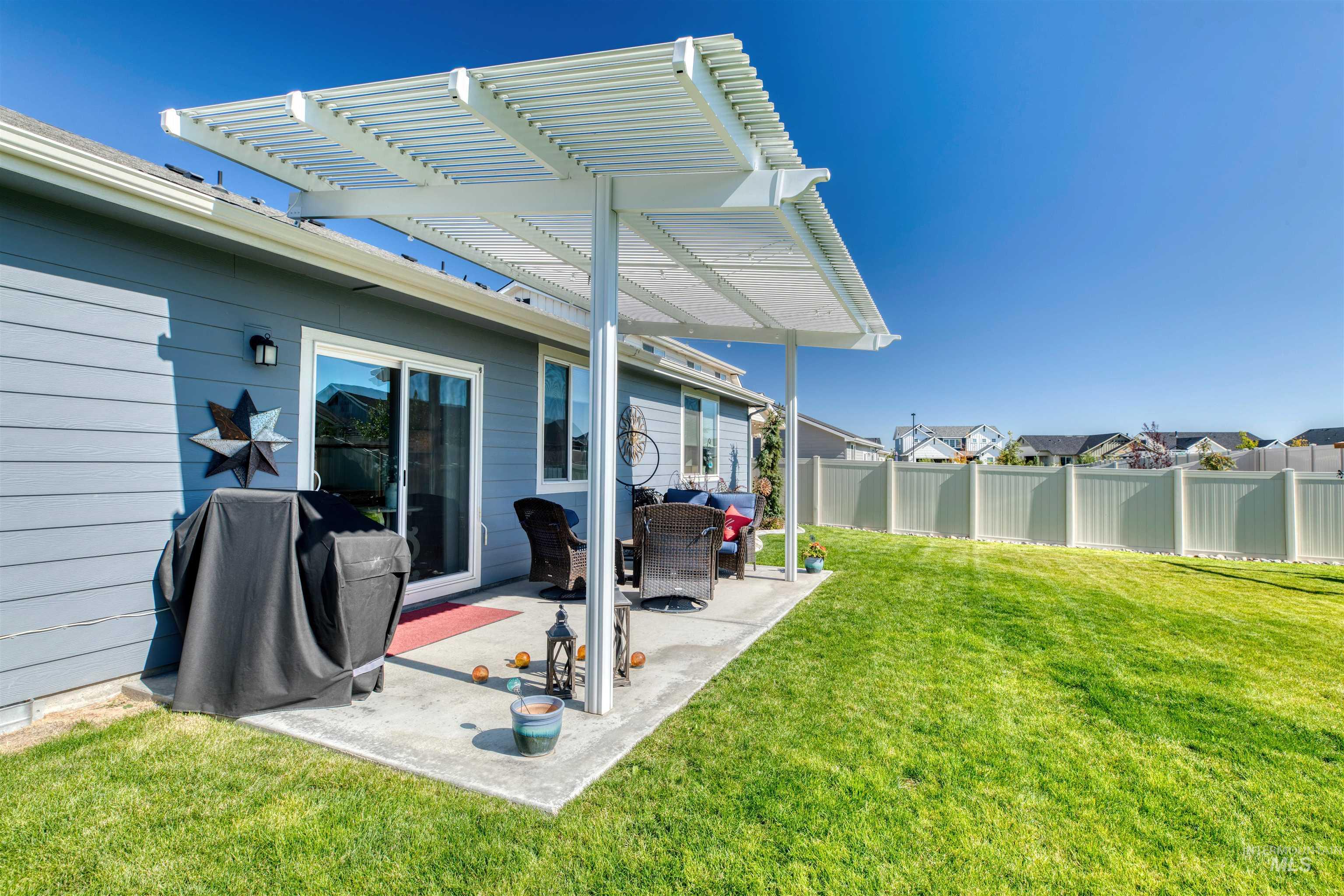 11913 West Piazza Street Nampa, ID 83686 - Photo 30 of 50 View of yard with a pergola and a patio area