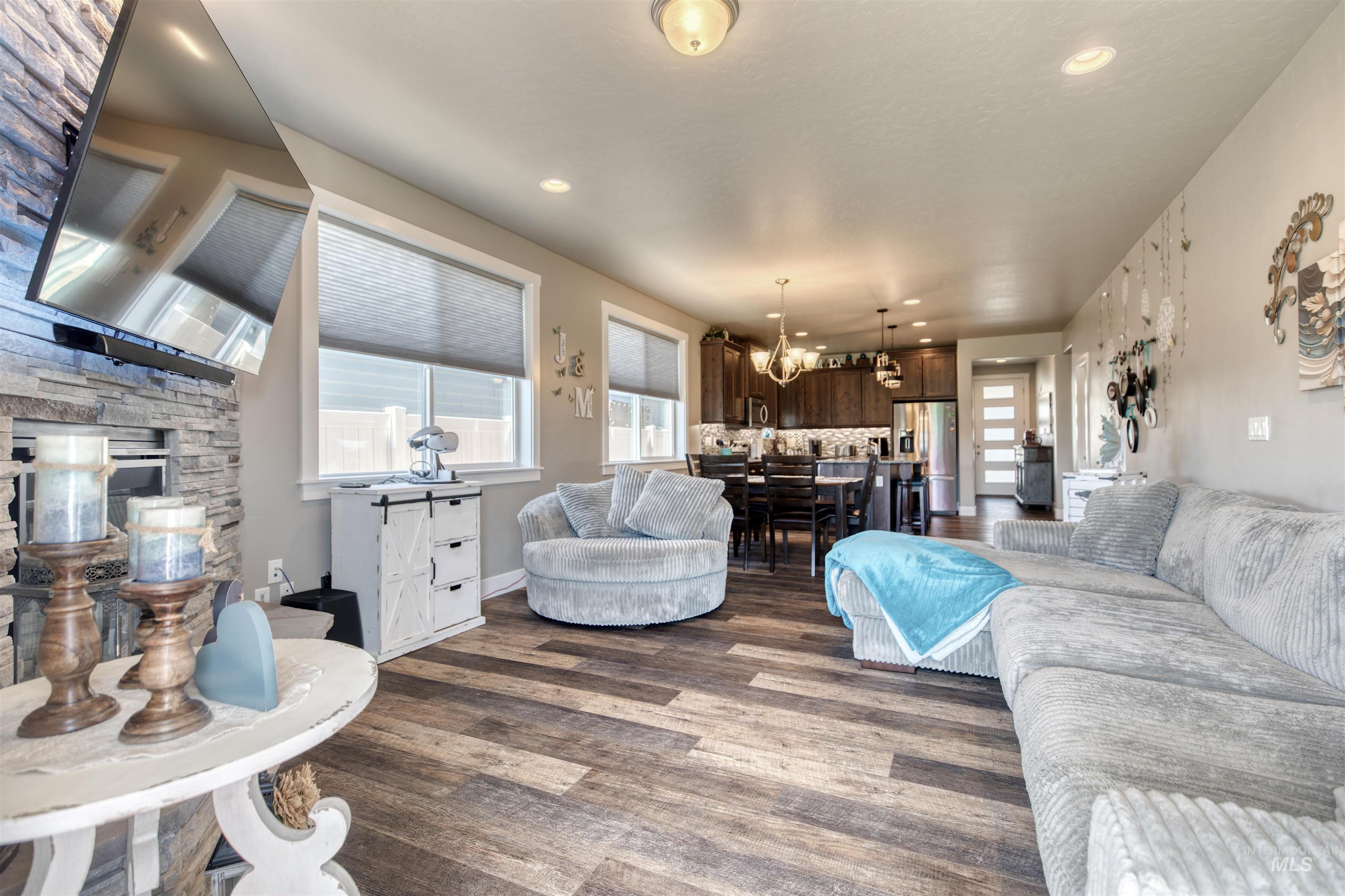 11913 West Piazza Street Nampa, ID 83686 - Photo 8 of 50 Living area with plenty of natural light, dark wood-type flooring, and recessed lighting