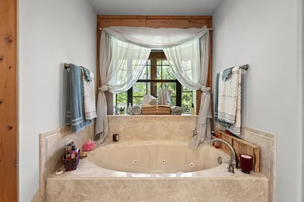 a room with pool table and a window