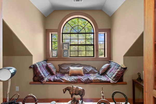 a view of room with furniture and book shelf