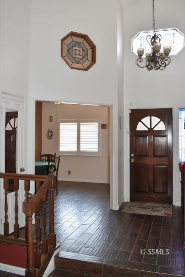 417 Montefino Drive Ridgecrest, CA 93555 - Photo 3 of 25 a view of a livingroom with furniture wooden floor kitchen and windows
