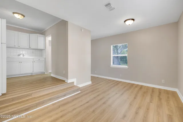 a view of an empty room and window