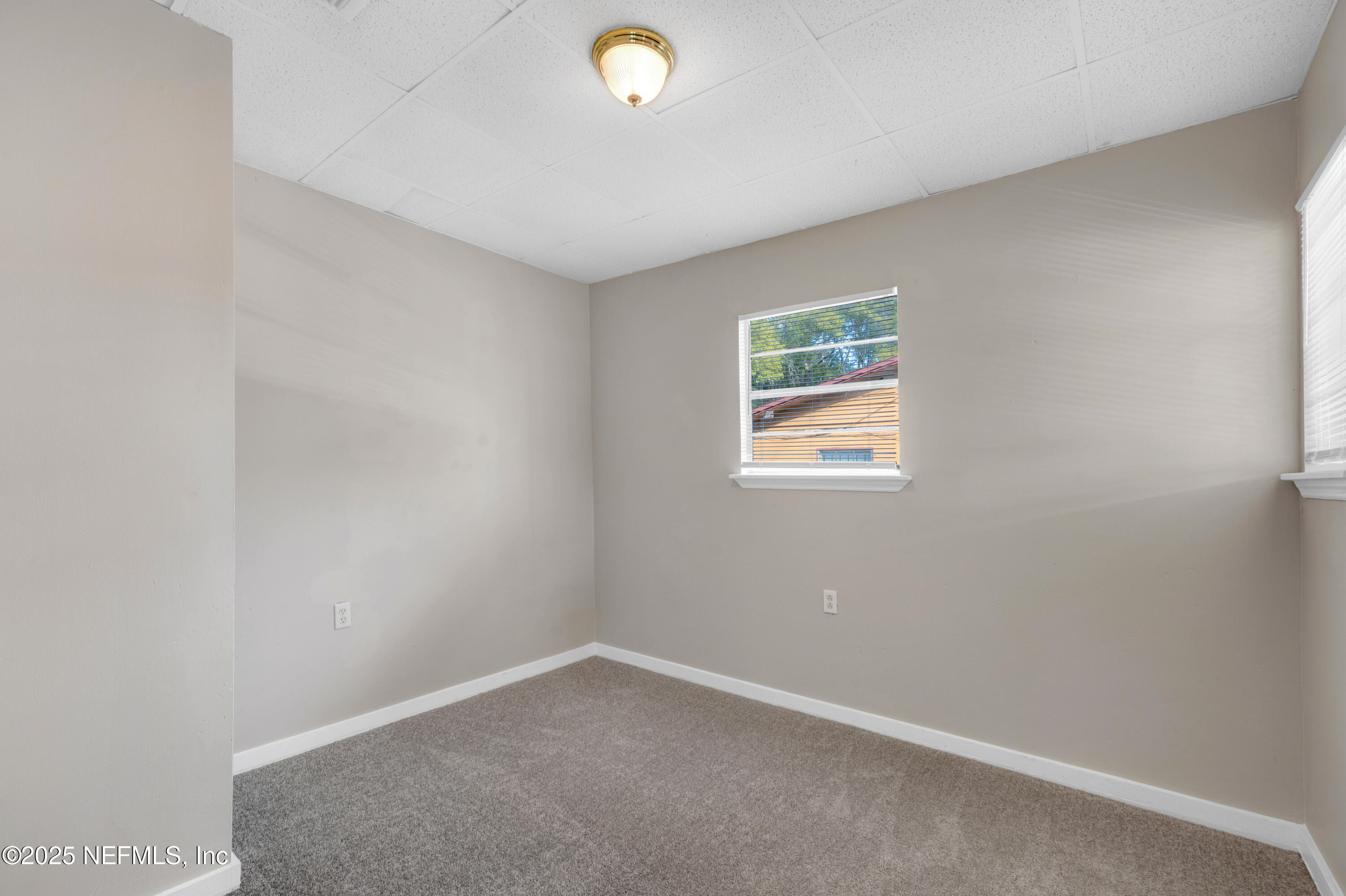 2971 West 16th Street Jacksonville, FL 32254 - Photo 14 of 21 an empty room with windows