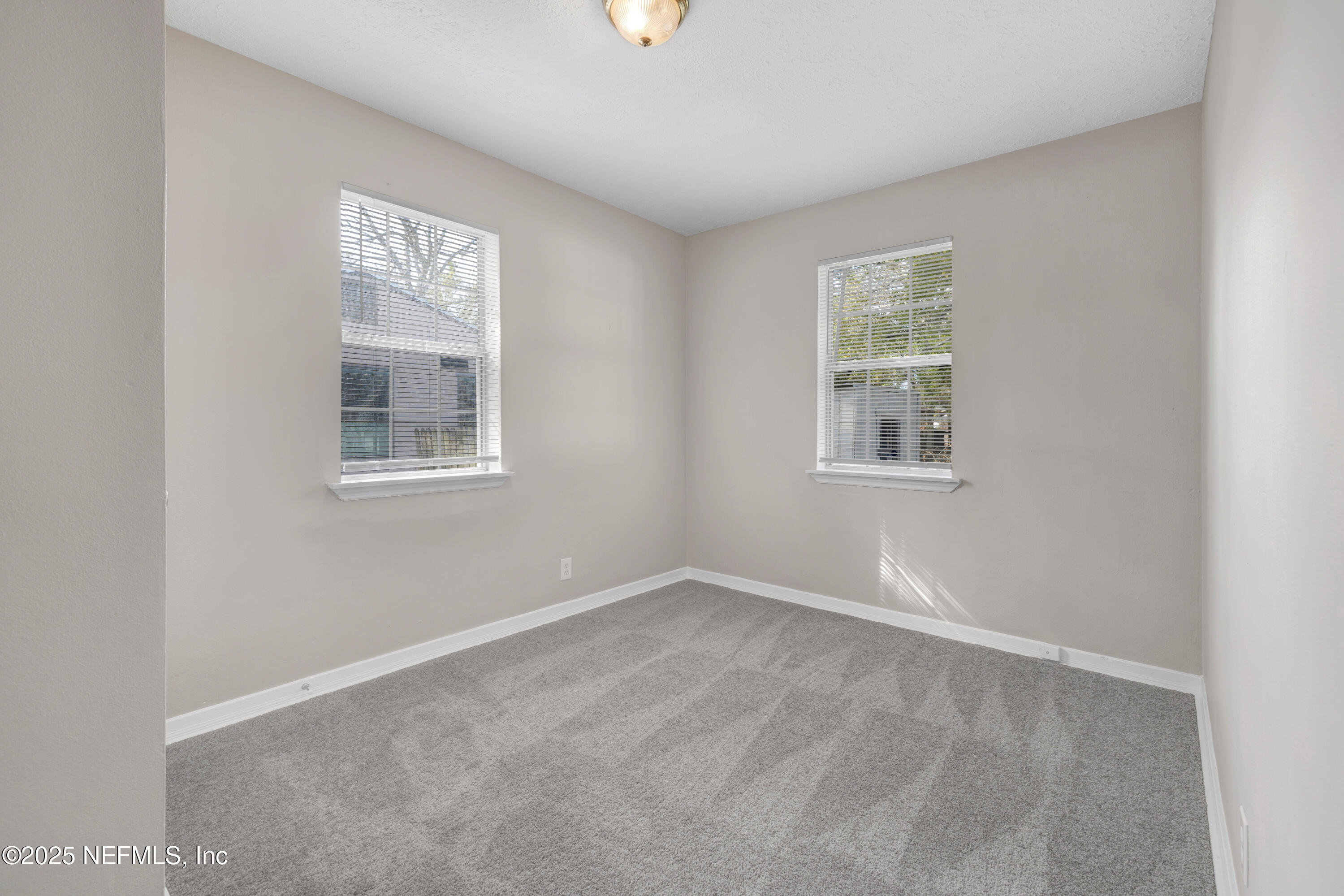2971 West 16th Street Jacksonville, FL 32254 - Photo 16 of 21 an empty room with windows
