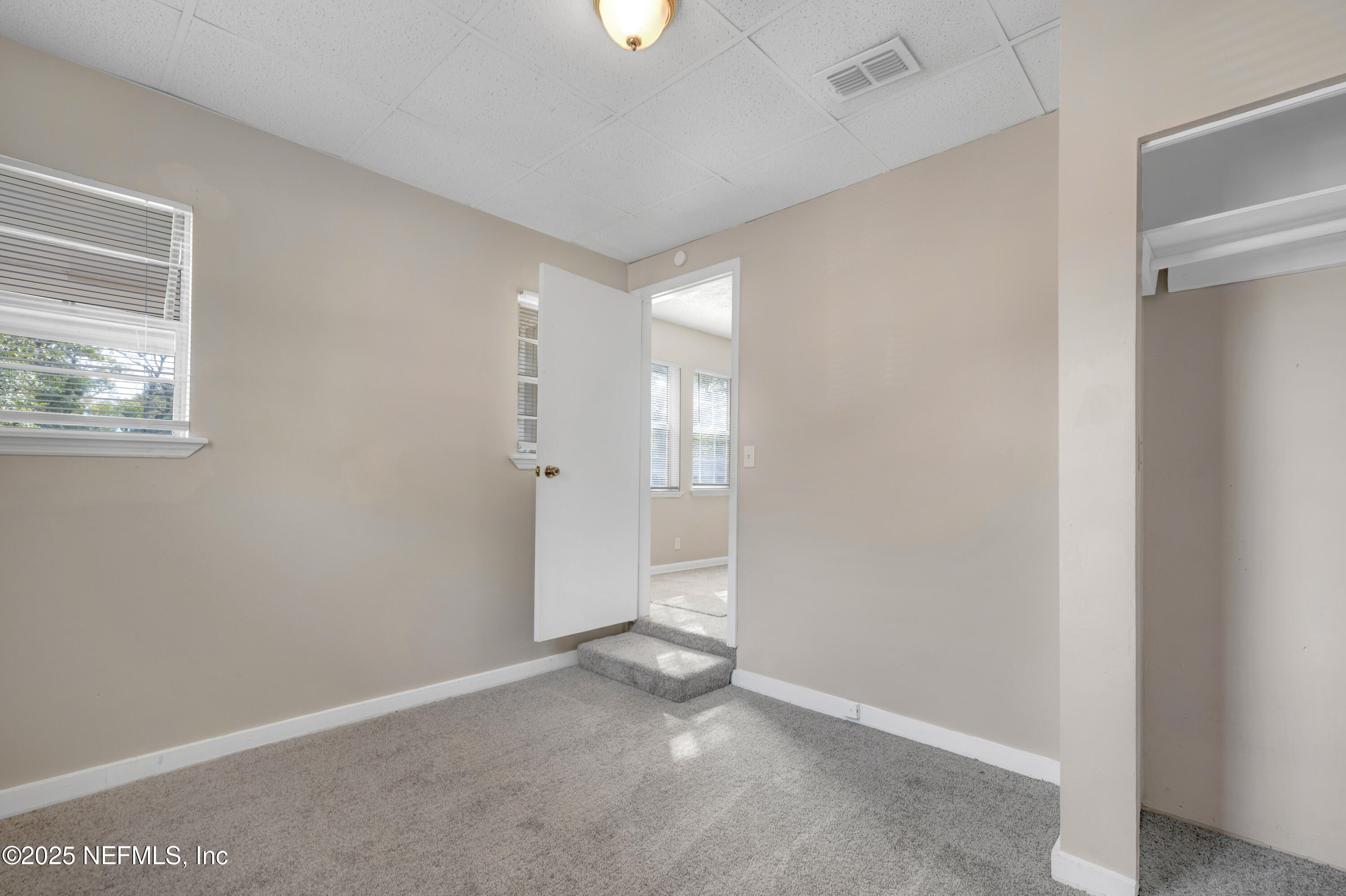 2971 West 16th Street Jacksonville, FL 32254 - Photo 7 of 21 a view of an empty room with a window