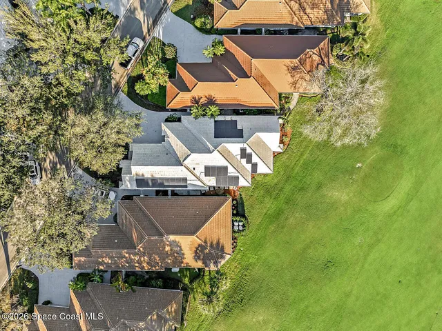 an aerial view of house with yard swimming pool and outdoor seating