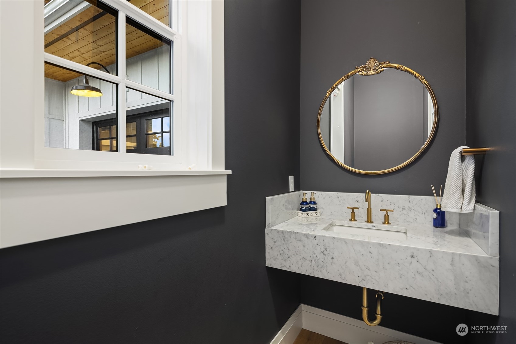 202 Woodhaven Place Edmonds, WA 98020 - Photo 19 of 40 a bathroom with a sink and a mirror