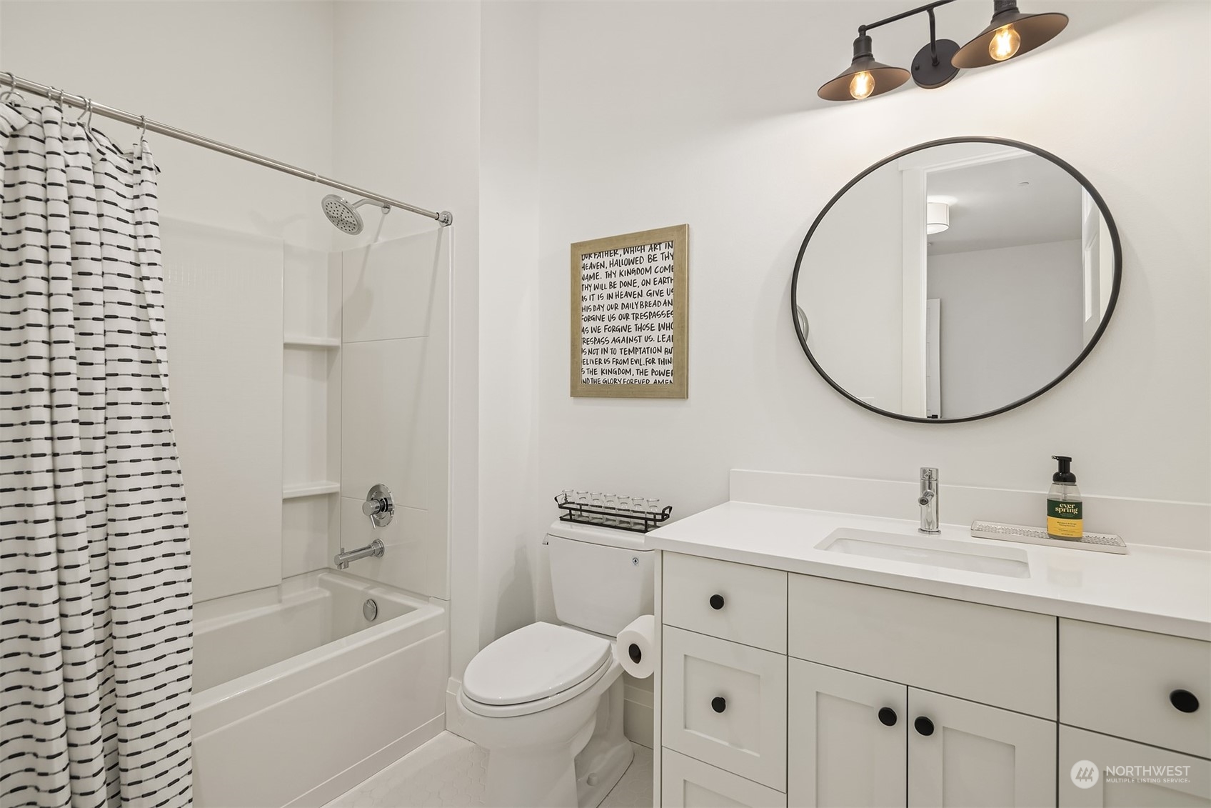 202 Woodhaven Place Edmonds, WA 98020 - Photo 21 of 40 a bathroom with a granite countertop sink toilet and a mirror