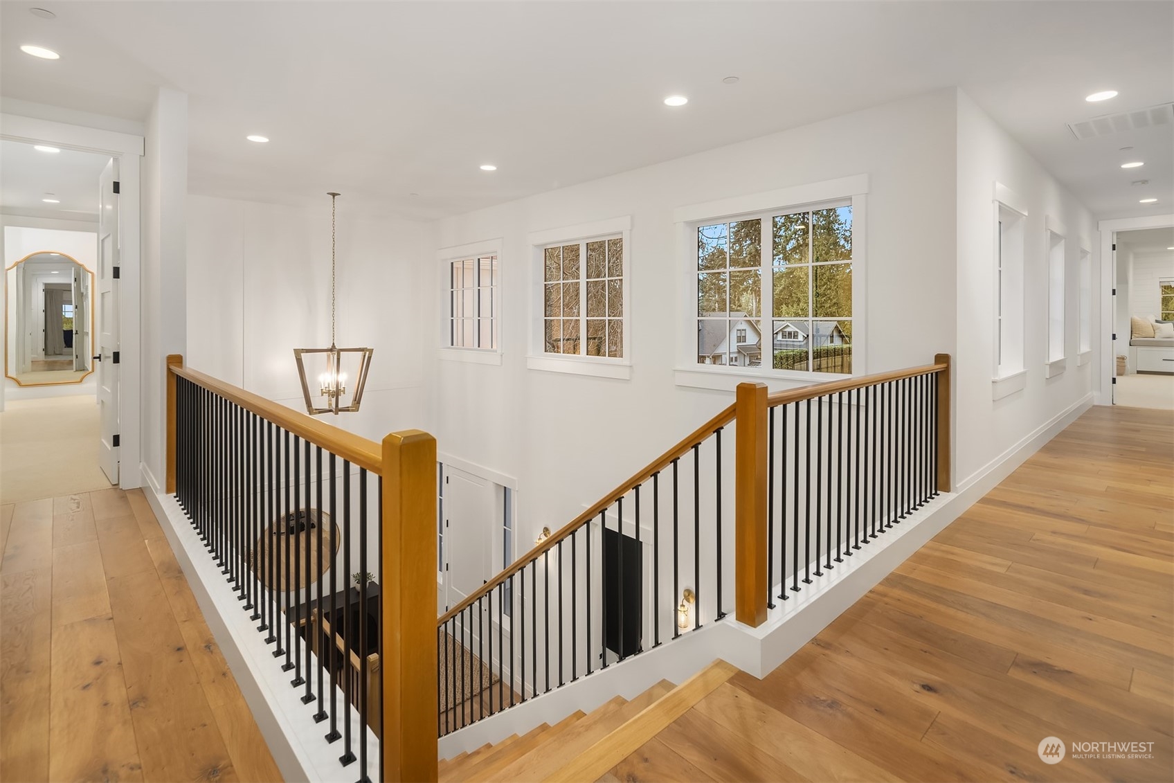 202 Woodhaven Place Edmonds, WA 98020 - Photo 24 of 40 a view of staircase with wooden floor and windows
