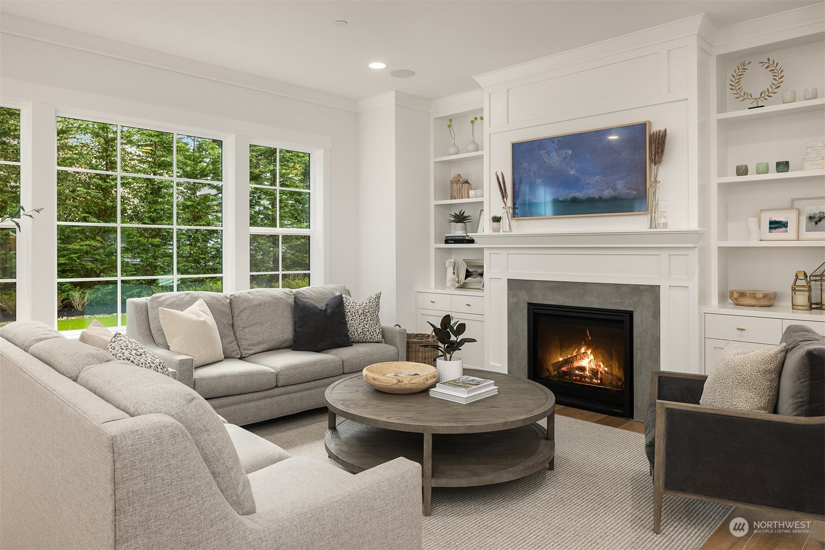 202 Woodhaven Place Edmonds, WA 98020 - Photo 6 of 40 a living room with furniture a fireplace and a flat screen tv