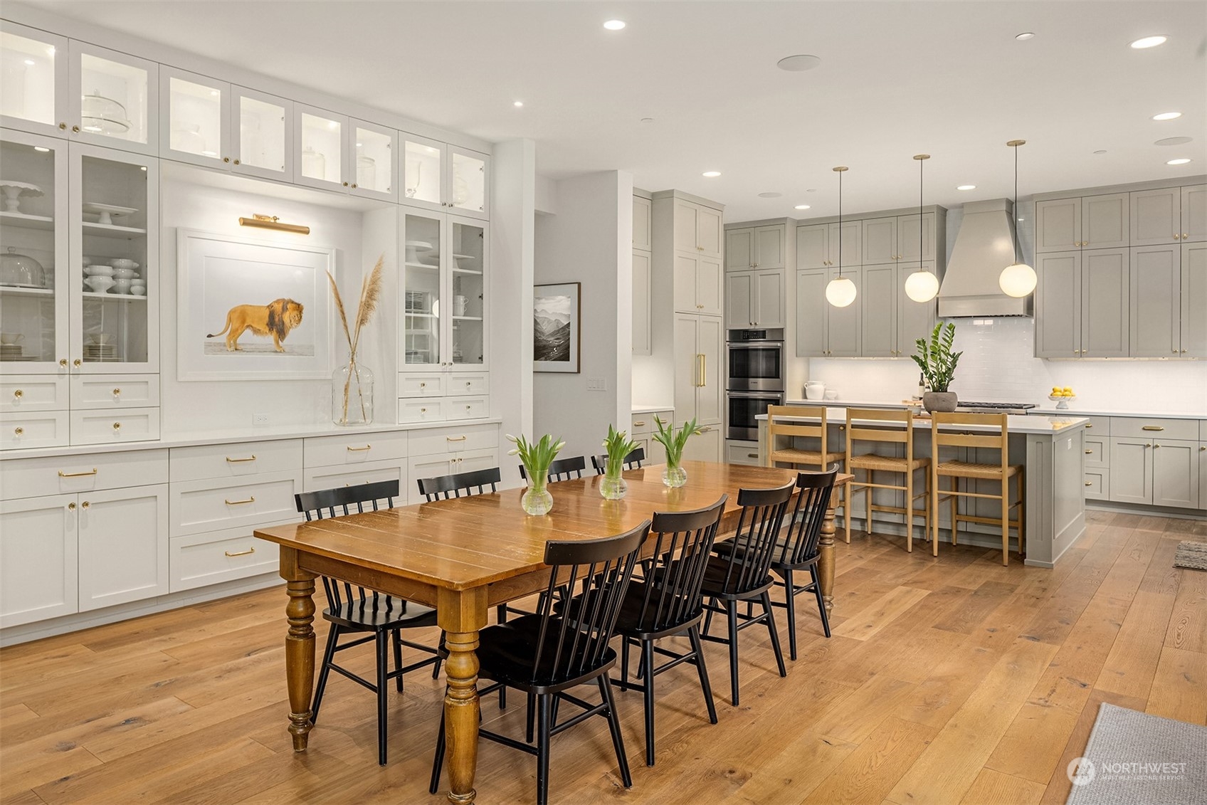 202 Woodhaven Place Edmonds, WA 98020 - Photo 9 of 40 a dining table with chairs and wooden floor