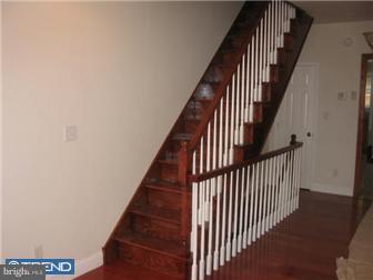 537 Wharton Street Philadelphia, PA 19147 - Photo 2 of 11 a view of staircase with railing and white walls