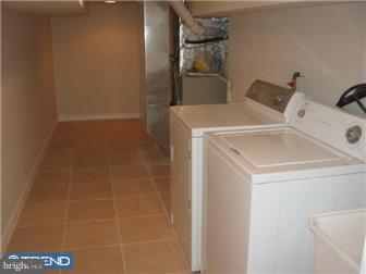 537 Wharton Street Philadelphia, PA 19147 - Photo 6 of 11 a utility room with dryer and washer