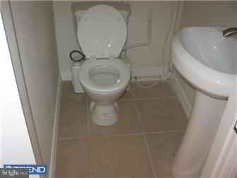 537 Wharton Street Philadelphia, PA 19147 - Photo 7 of 11 a bathroom with a sink and a toilet