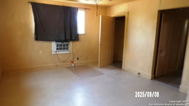 a view of a door and an empty room