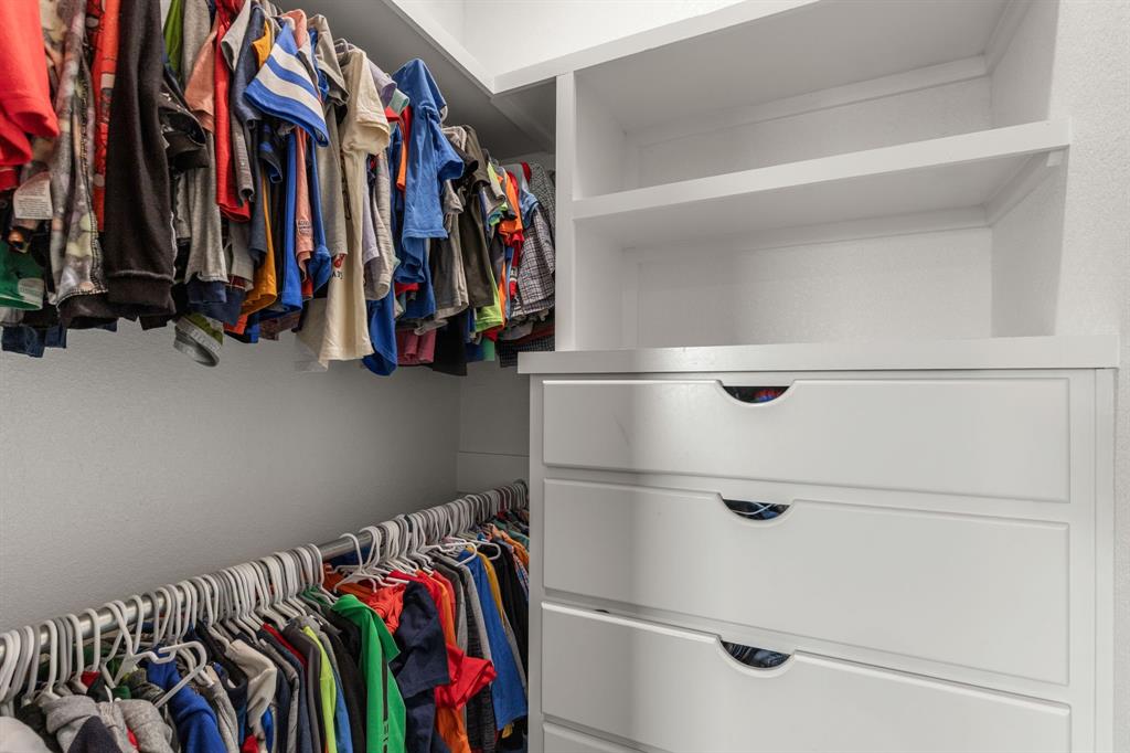 515 Sales Road Windthorst, TX 76389 - Photo 29 of 34 a view of walk in closet with clothes and shoes