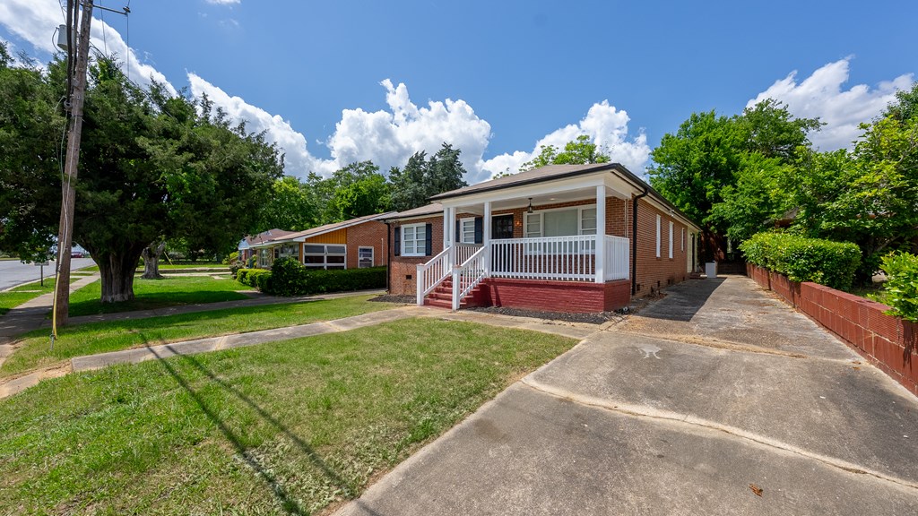 3127 8th Street Columbus, GA 31906 - Photo 3 of 14 a front view of a house with garden