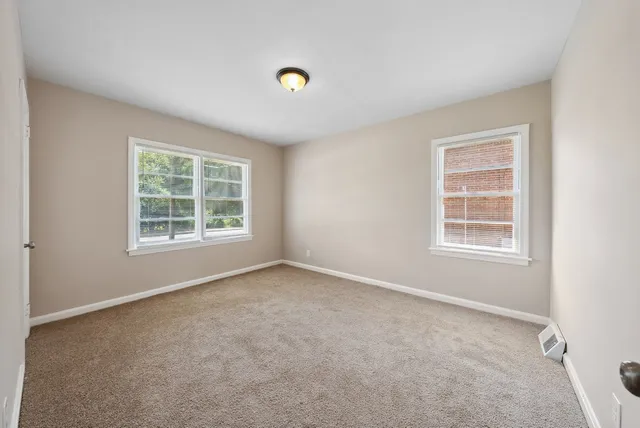 an empty room with windows