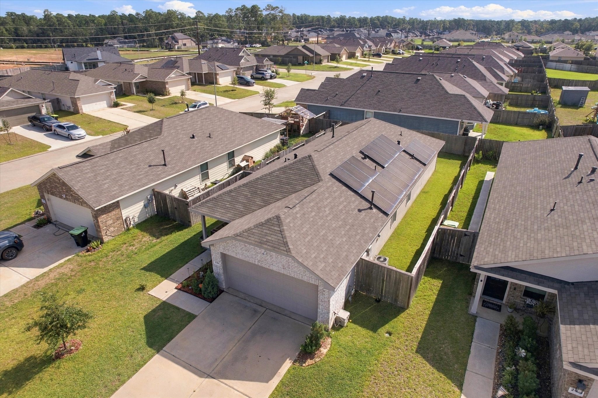248 Rustic Ridge Circle Magnolia, TX 77354 - Photo 22 of 27 Aerial view showcasing the solar panels