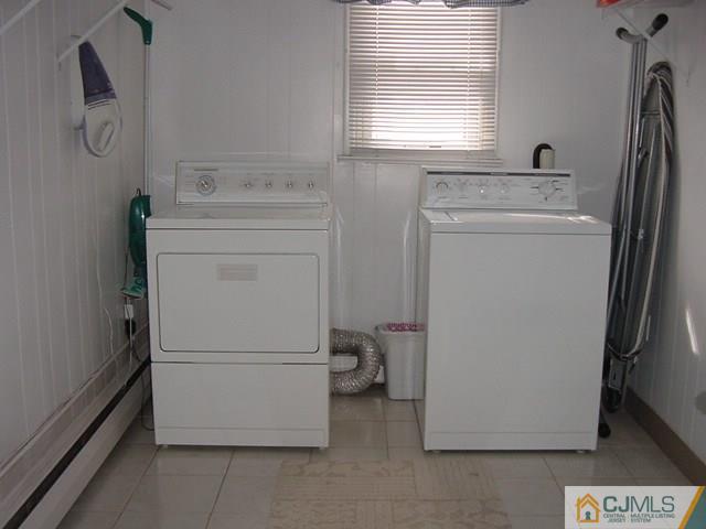 28 Stony Road West Edison, NJ 08817 - Photo 14 of 25 a utility room with dryer and washer