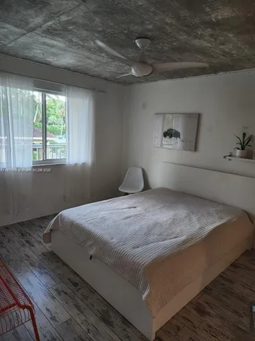 a view of workspace with furniture and window