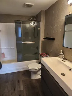 a bed room with a bed and a television