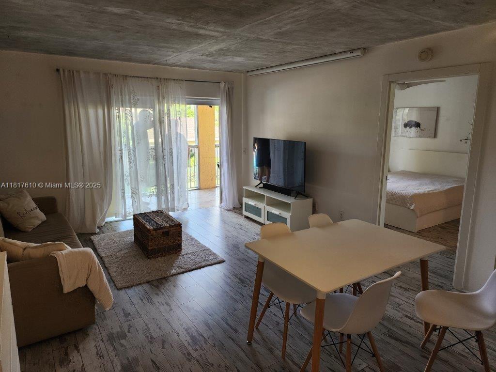 460 South Park Road, Unit 6209 Hollywood, FL 33021 - Photo 10 of 13 a living room with furniture and a flat screen tv