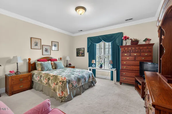 a bedroom with a bed and furniture