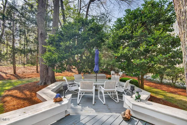 a view of a dinning table and chairs in the patio