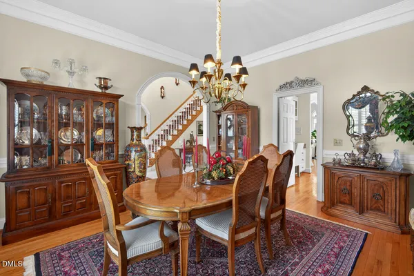 a view of a dining room with furniture and wooden floor